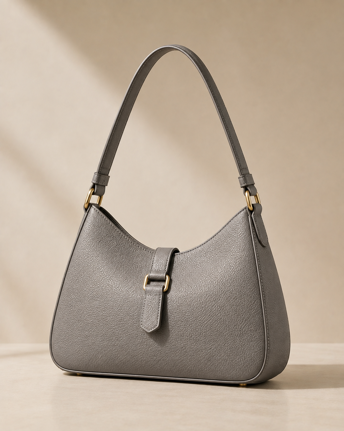 The Structured Satchel, black leather satchel on white textile